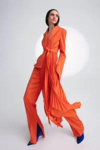 Peggy Iconic pleated tuxedo jacket in orange